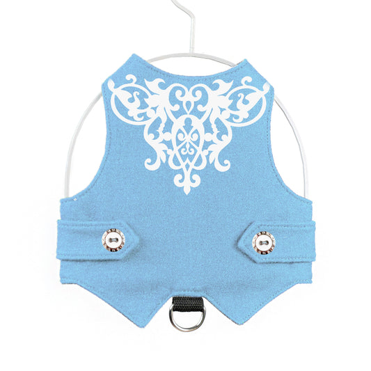 Blue cat harness with white decorative pattern.