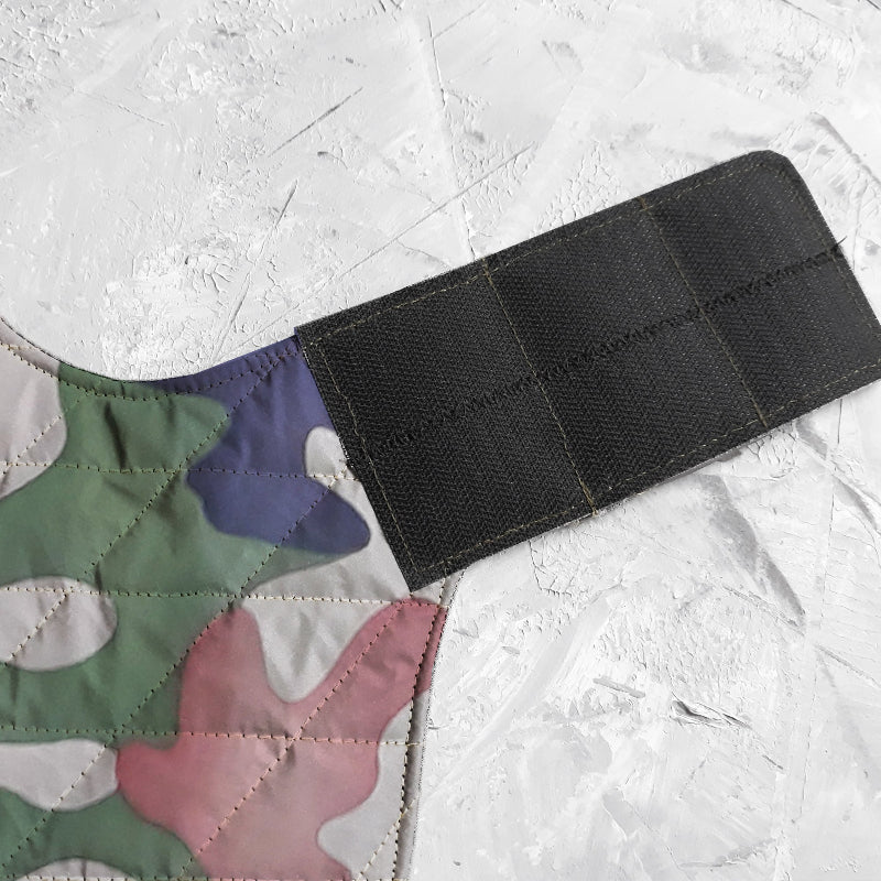 A quilted camo cat harness with reflective silver stripe
