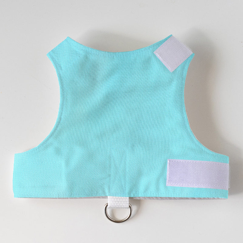 Light blue vest with white patches on a light gray background