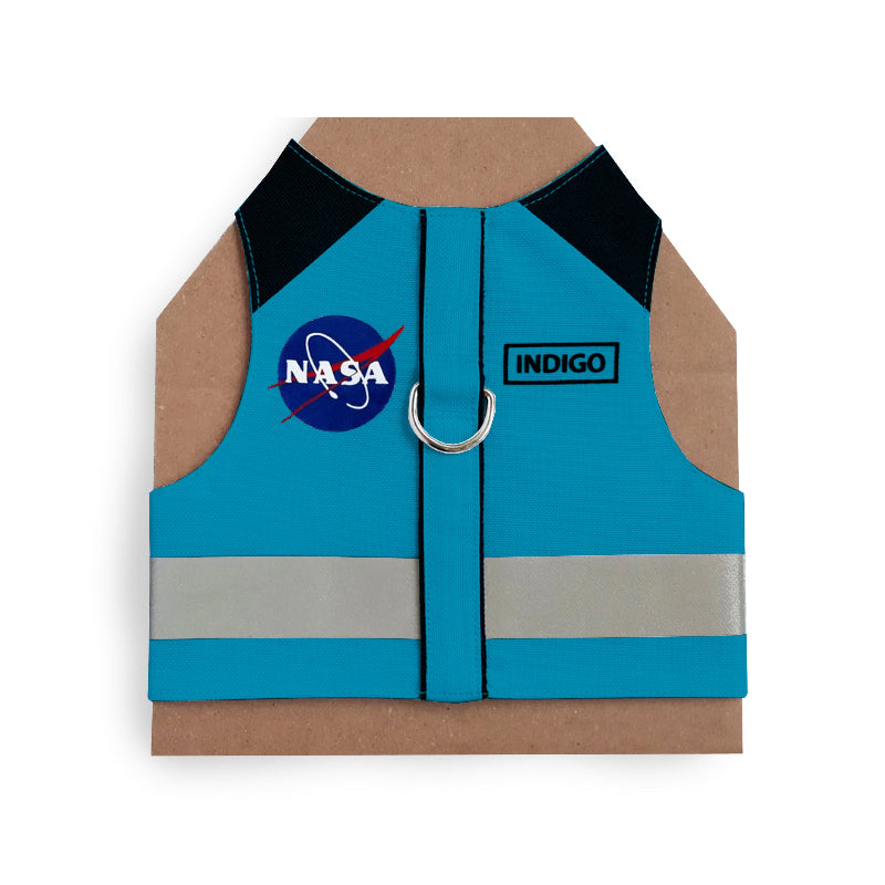 Blue cat harness with black shoulder accents, a NASA logo patch, a reflective silver stripe