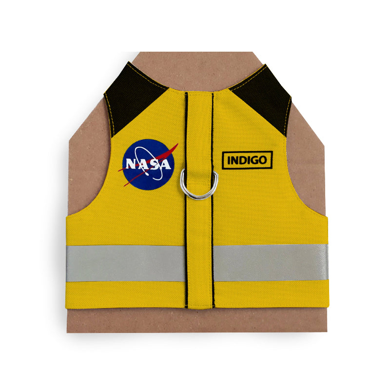 Yellow cat harness with black shoulder accents, a NASA logo patch, a reflective silver stripe