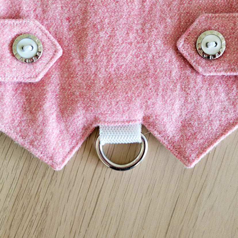 A pink tweed cat harness with a silver mountain patch, decorative buttons, and a black D-ring
