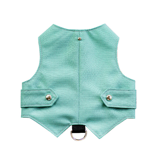 Azure textured cat harness with a vest-like design, featuring two small flaps with silver button accents and a black leash attachment loop with a silver D-ring.