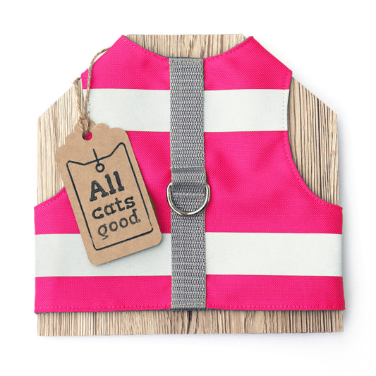 A bright pink, high-visibility, potentially water-repellent cat safety harness with two horizontal silver reflective stripes. It features a grey central strap and a metal D-ring for leash attachment. This harness is designed for safety and visibility.