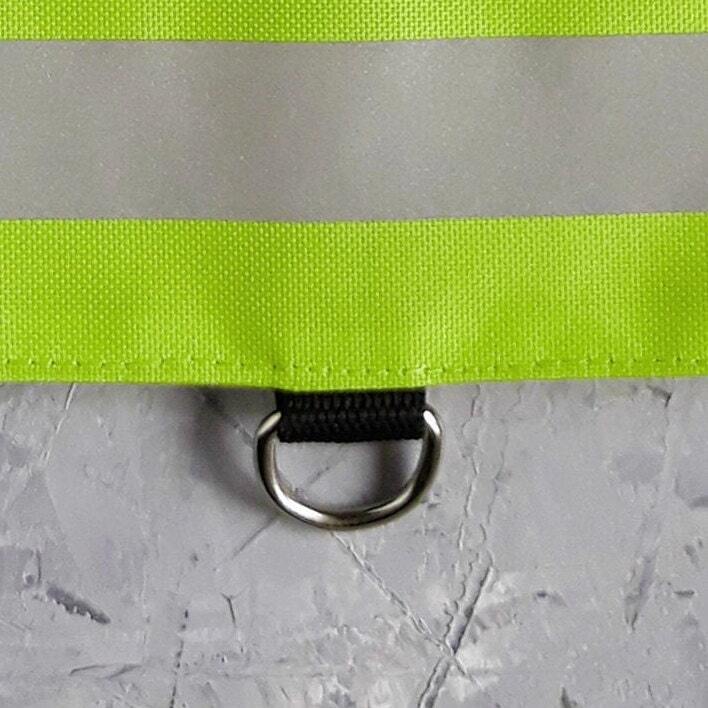 High-visibility green cat harness with reflective elements and "SECURITY" text for added safety.