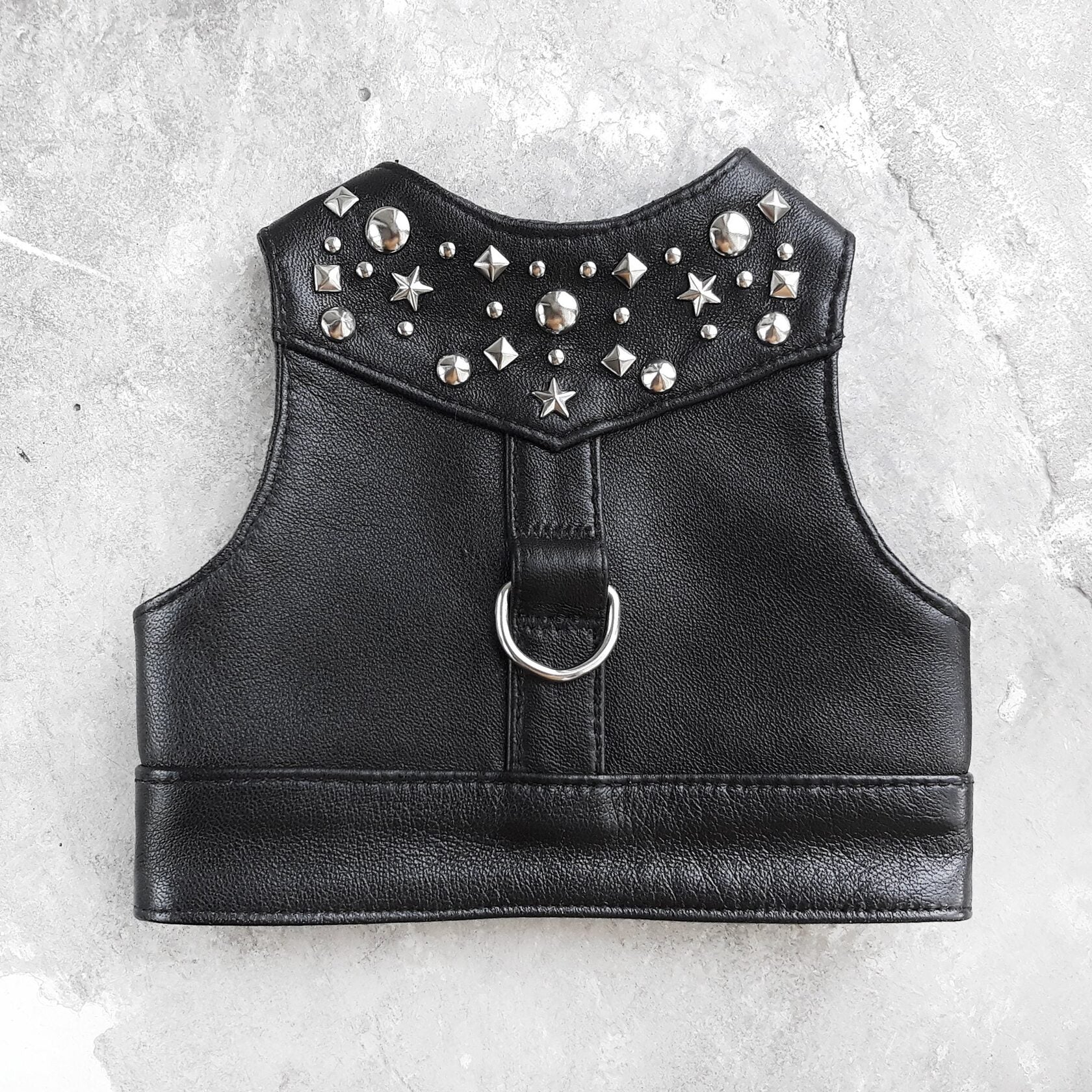 Stylish black leather harness vest for cats with metallic rivets for a secure and fashionable fit