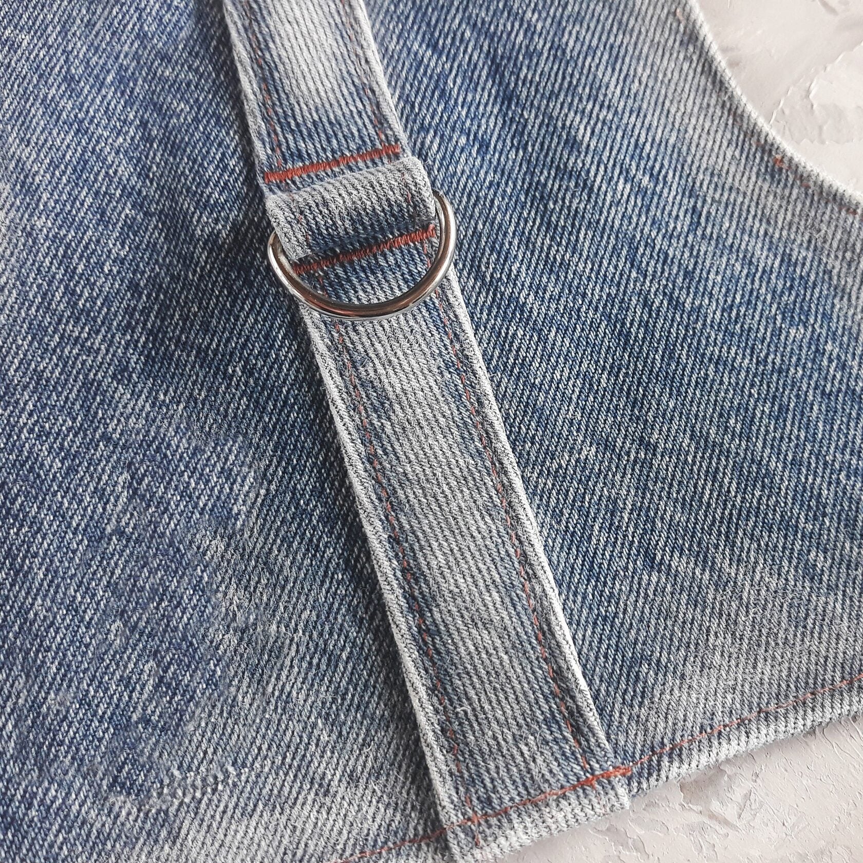 Quality Hardware for Safety: Close-up of the D-Ring on Our Durable Upcycling Denim Cat Harness (Escape-Proof). Shop Functional & Secure Pet Gear!