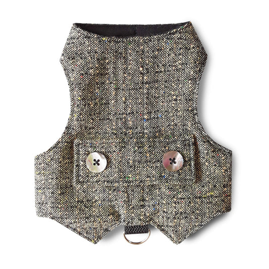 A tweed cat harness with colorful flecks, decorative mother-of-pearl buttons, and a silver D-ring.
