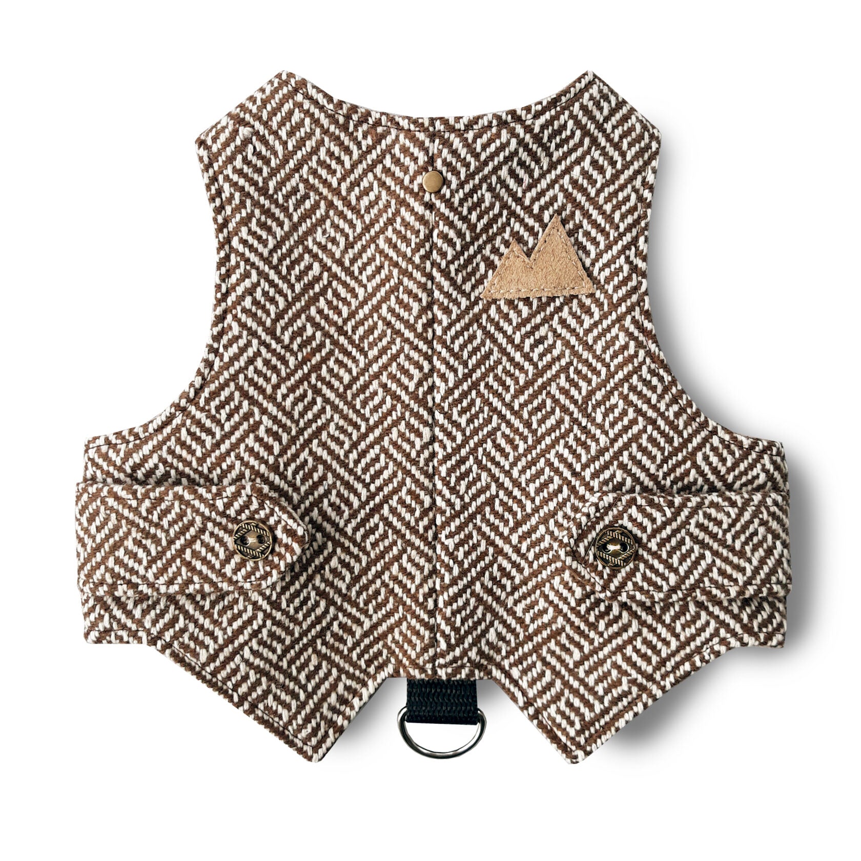A cat harness made from brown tweed fabric with a distinctive geometric pattern. A functional D-ring connected by a black strap.