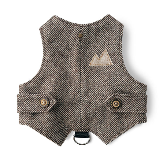 A brown tweed cat harness with a diagonal stripes pattern and decorative details.