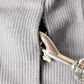 A gray cotton sweater designed for a pet is shown on a white background