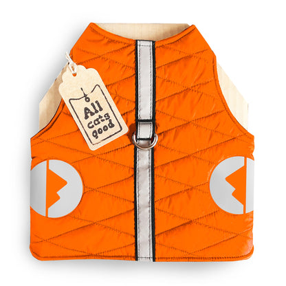 A quilted orange cat harness with reflective silver stripes, circular reflective elements, and a brown "Allcatsgood" tag.