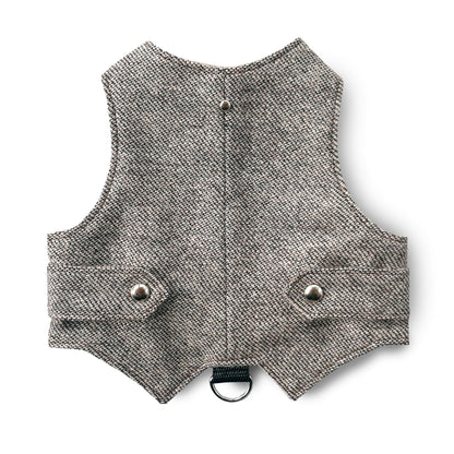 A light brown tweed cat harness with silver decorative buttons and a black D-ring